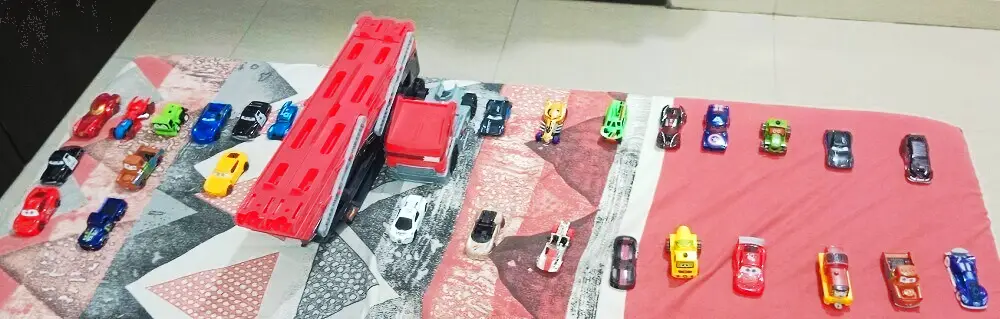 hot wheels collection on bed