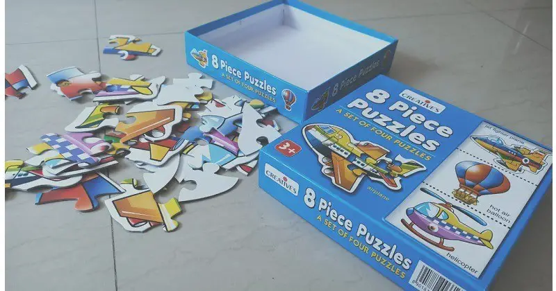 kids puzzle games pieces on the floor
